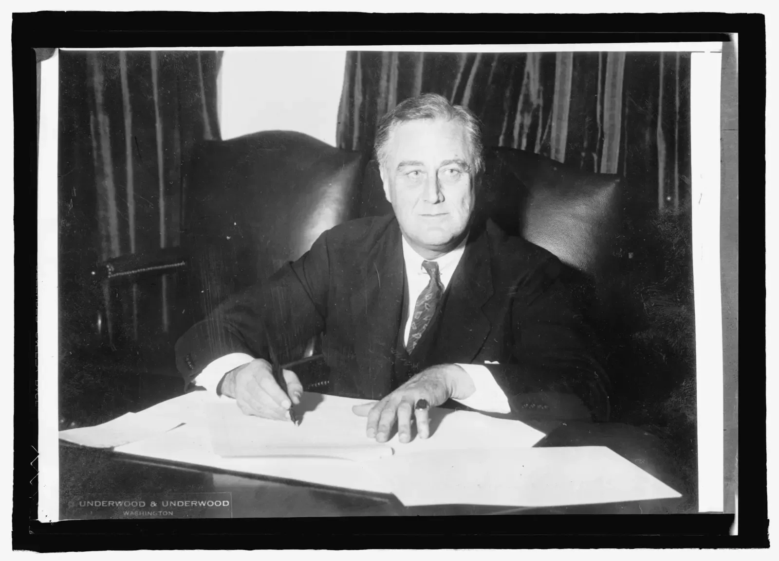President Franklin D. Roosevelt signing legislation in 1933